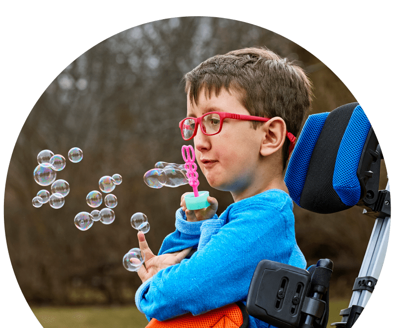 Bear outdoors blowing bubbles