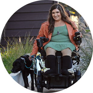 An adult and their dog outdoors